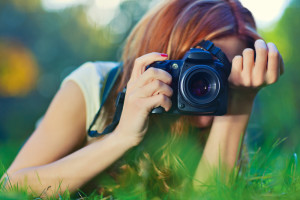 woman taking pictures outdoors